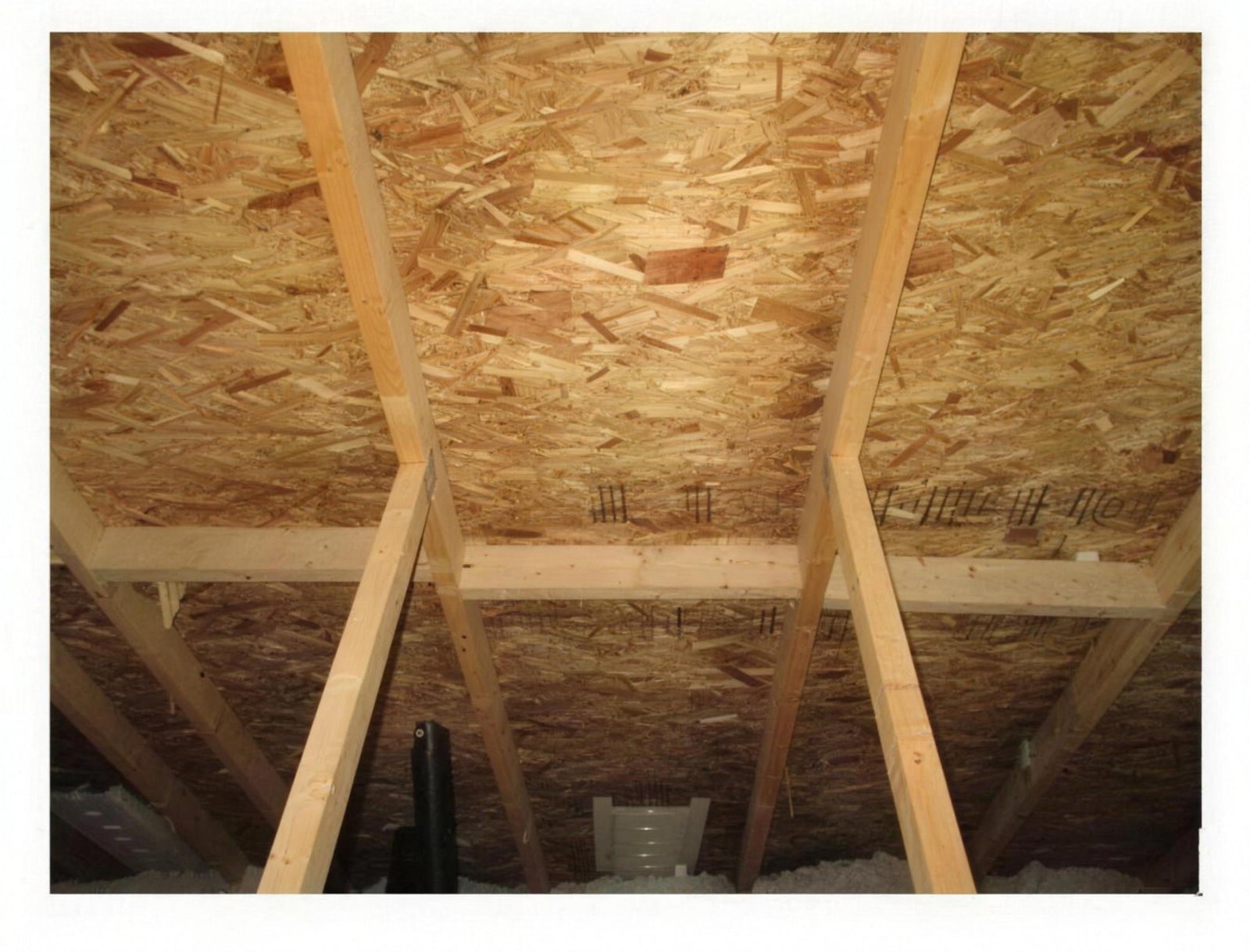 The same attic sheathing after On & Gone treatment